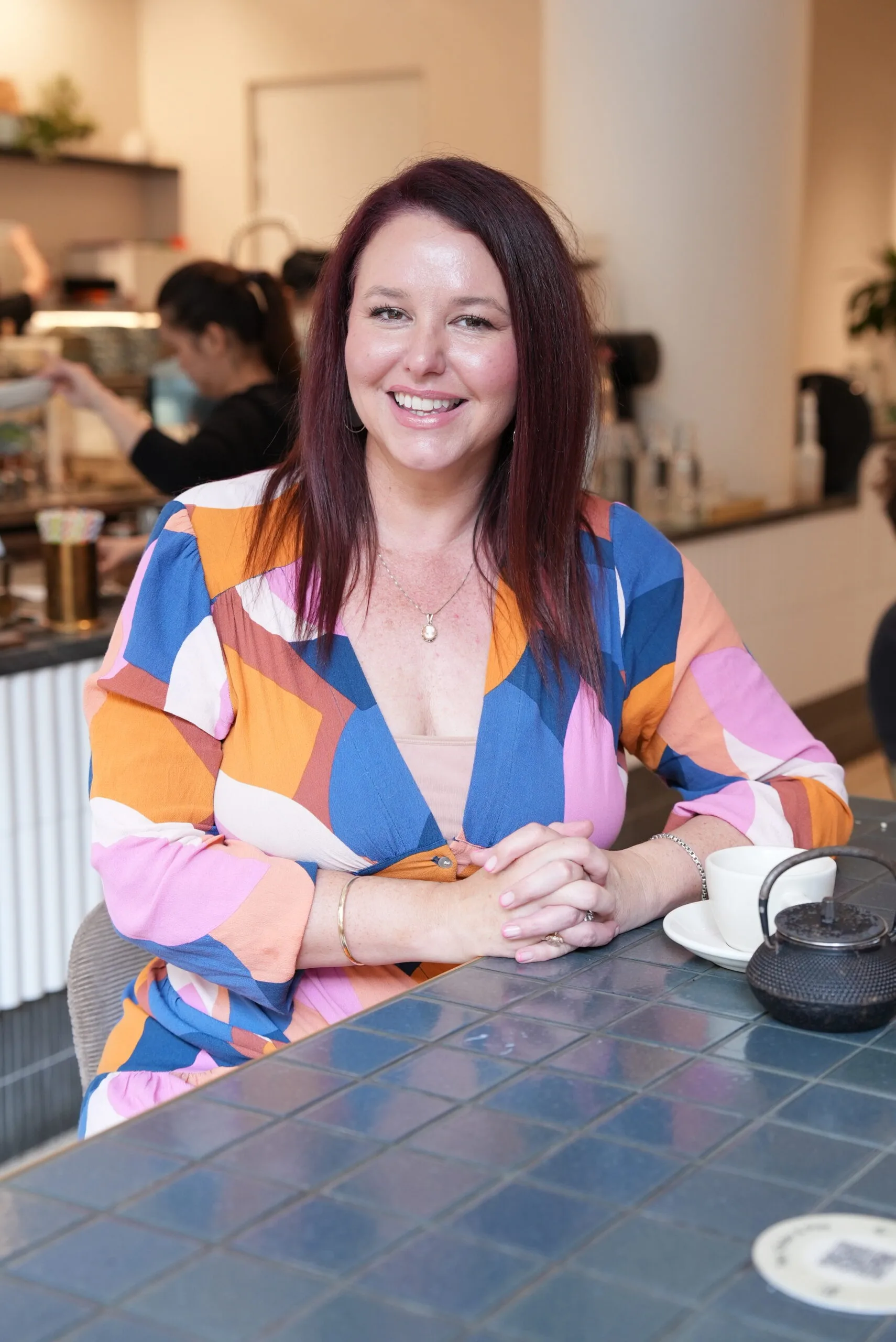 Image of author wearing colourful dress