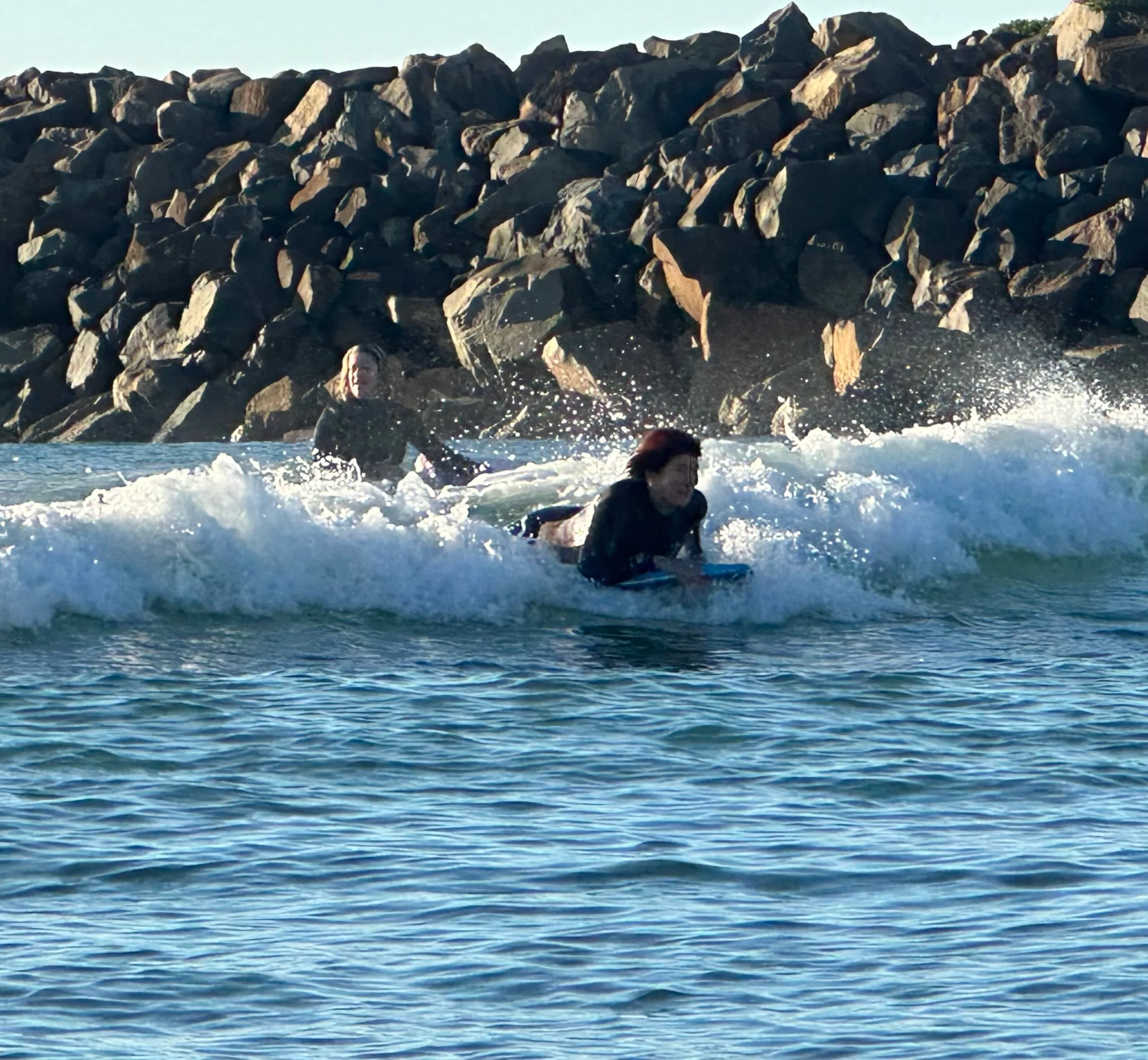 Woman on surf board in the ocean.