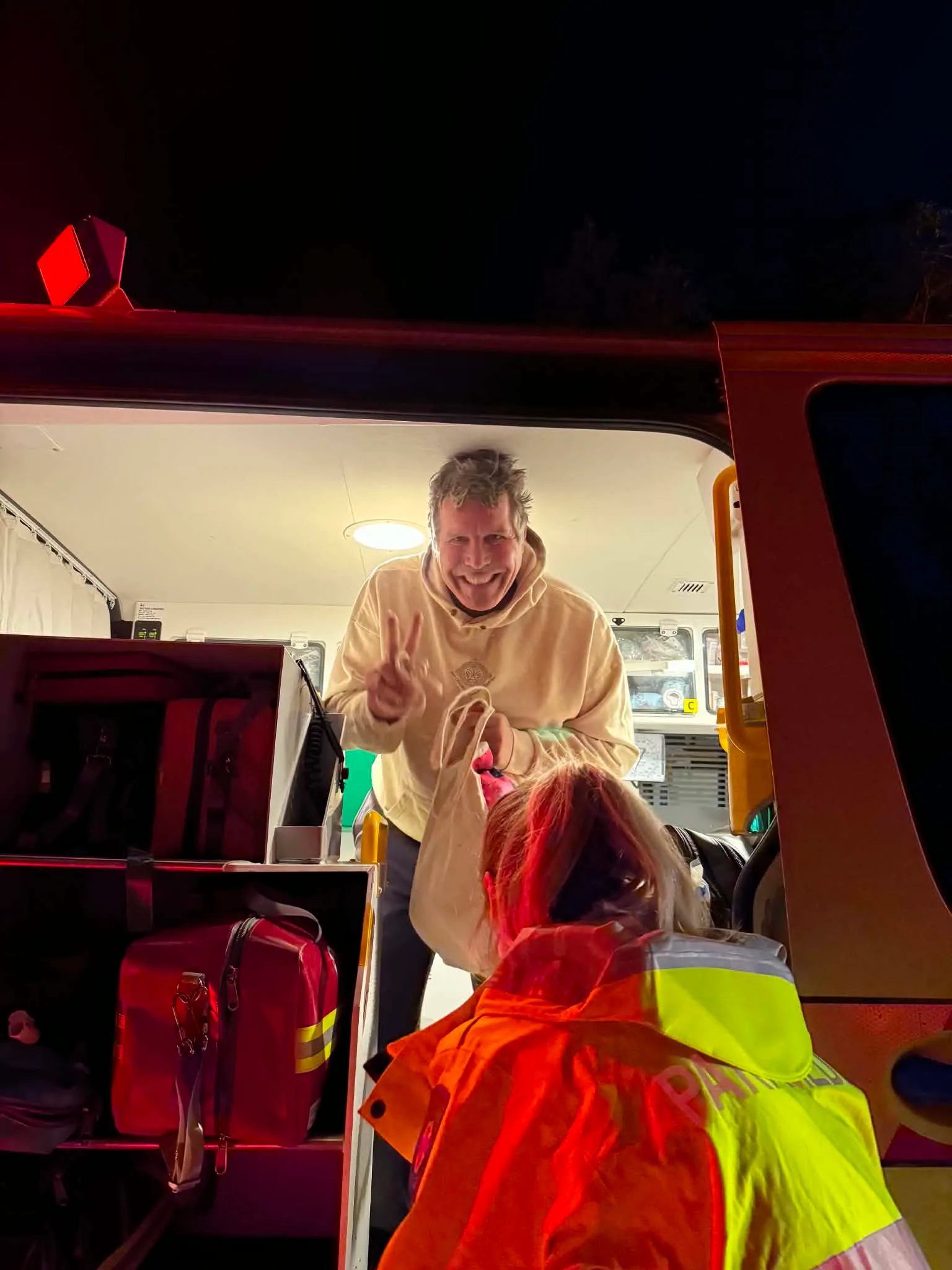 man smiling in ambulance 