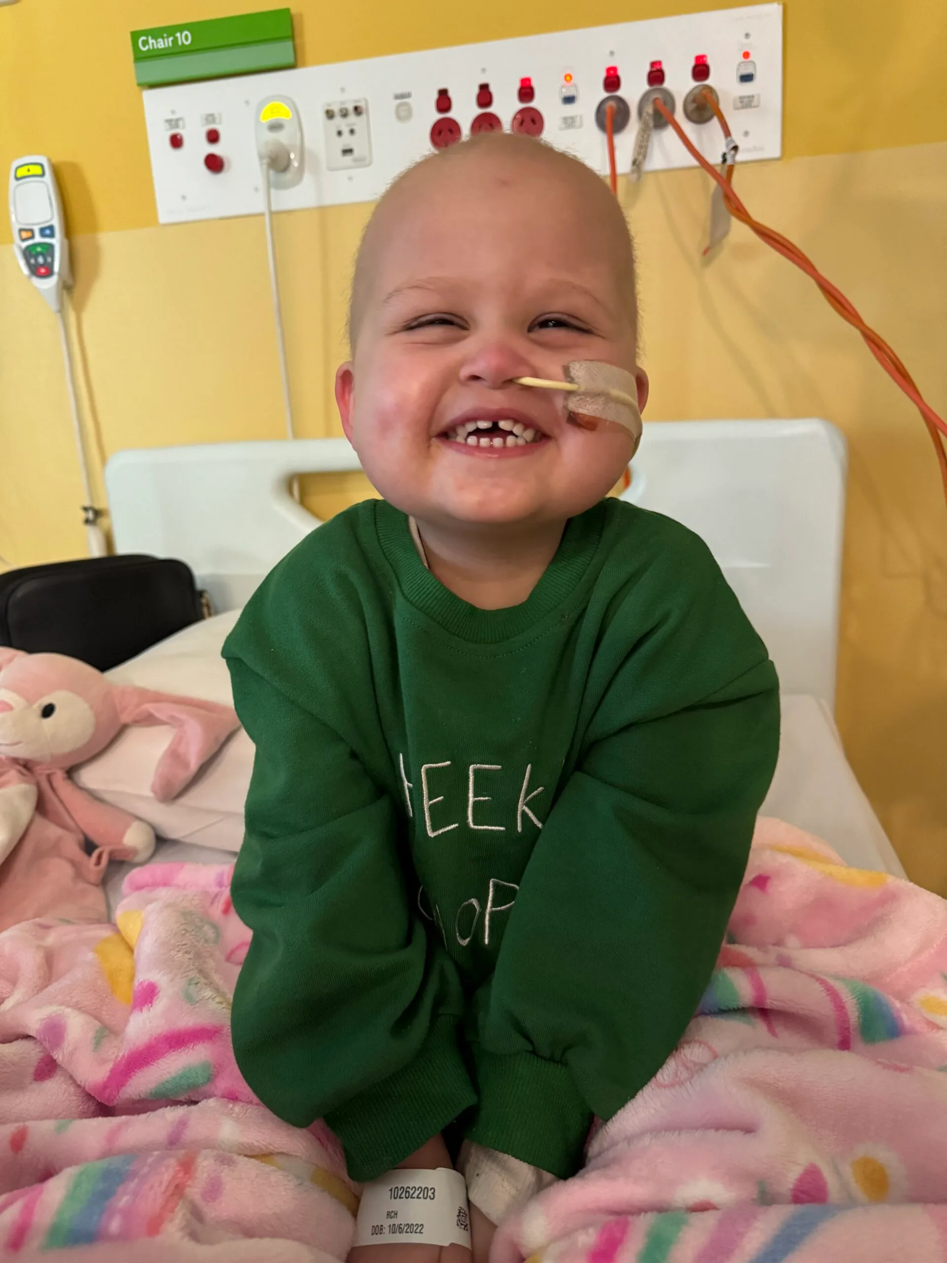 girl with short hair in green jumper in hospital 