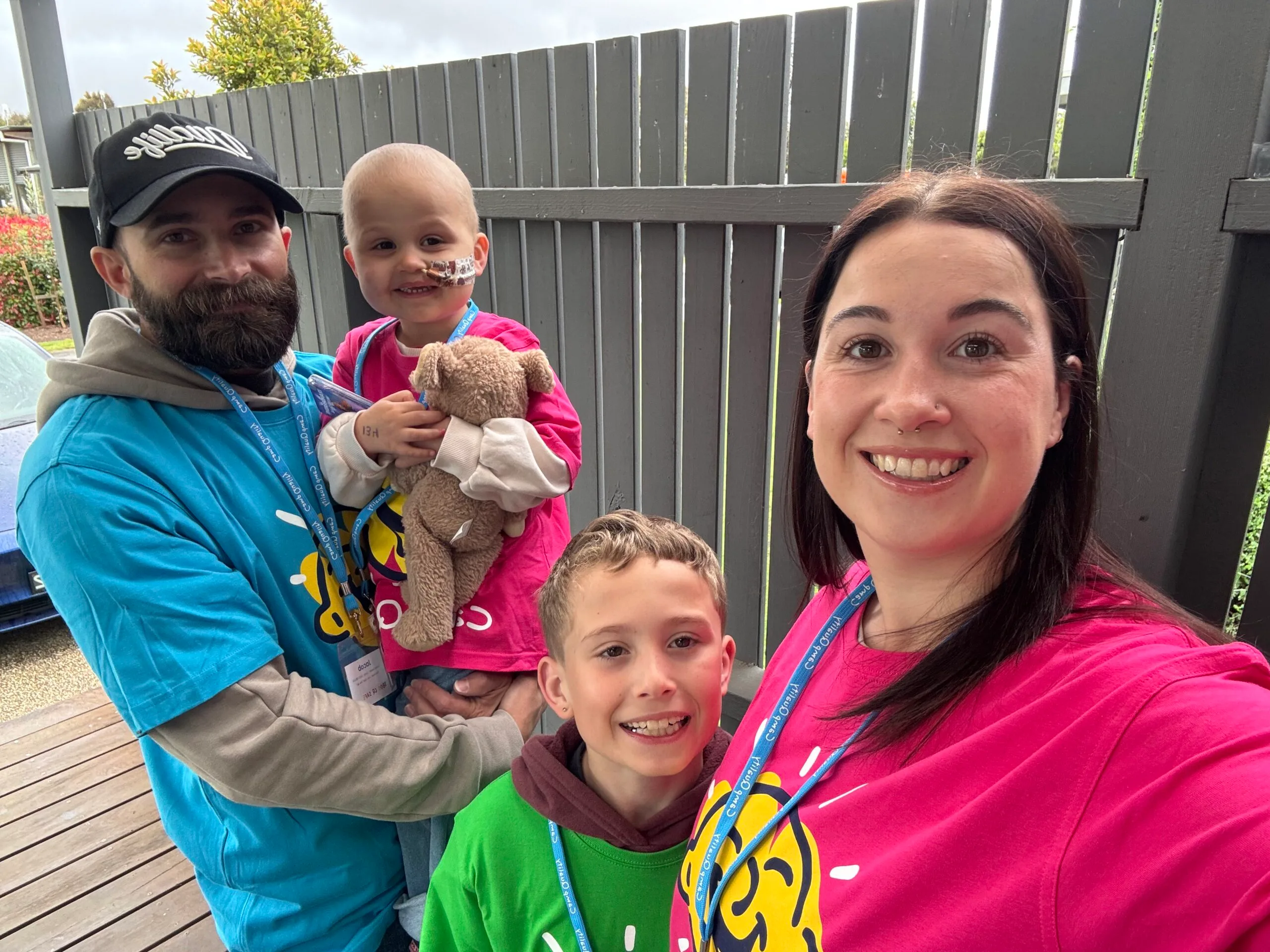 family in bright camp quality shirts 