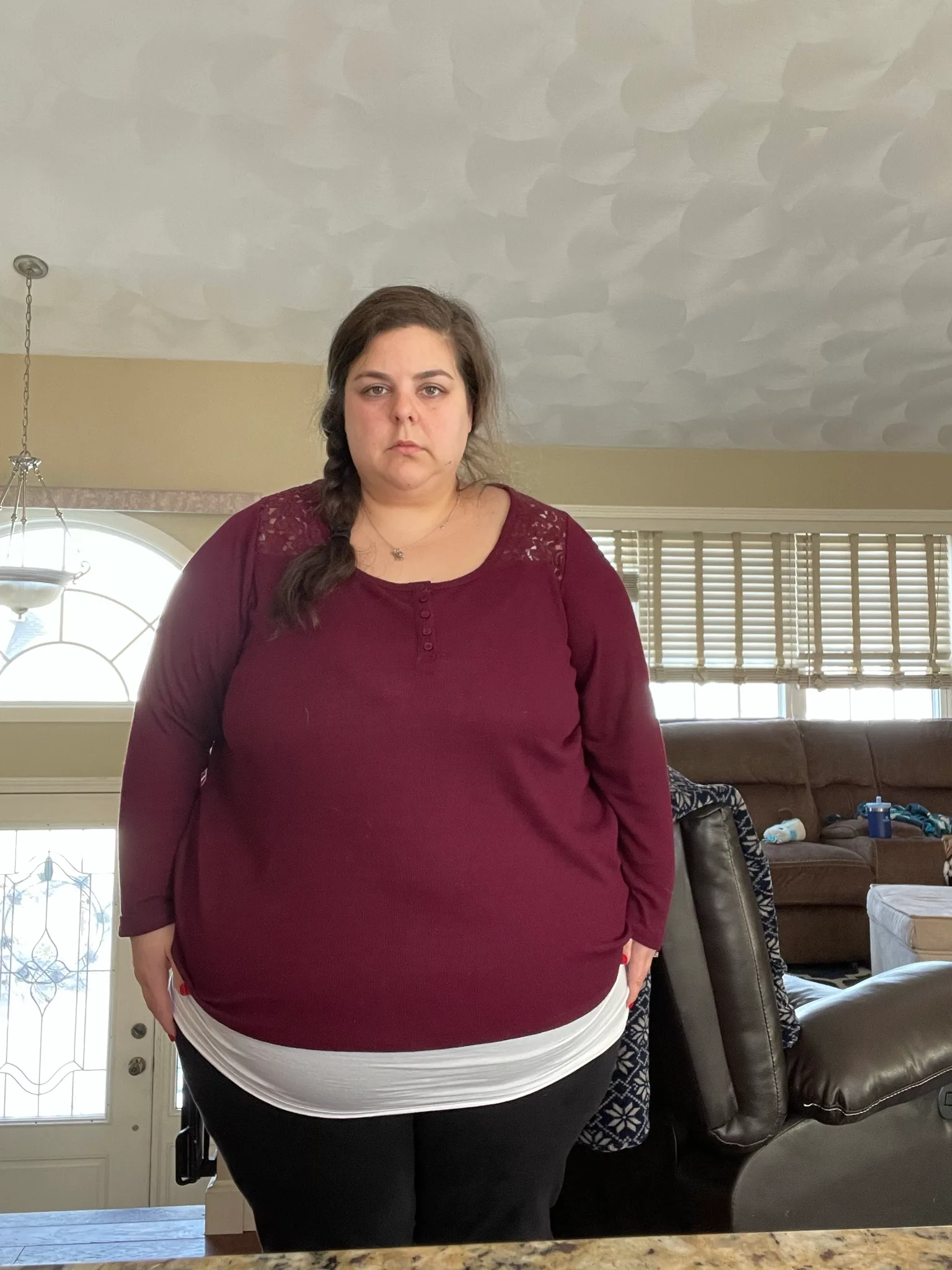 Woman in maroon top