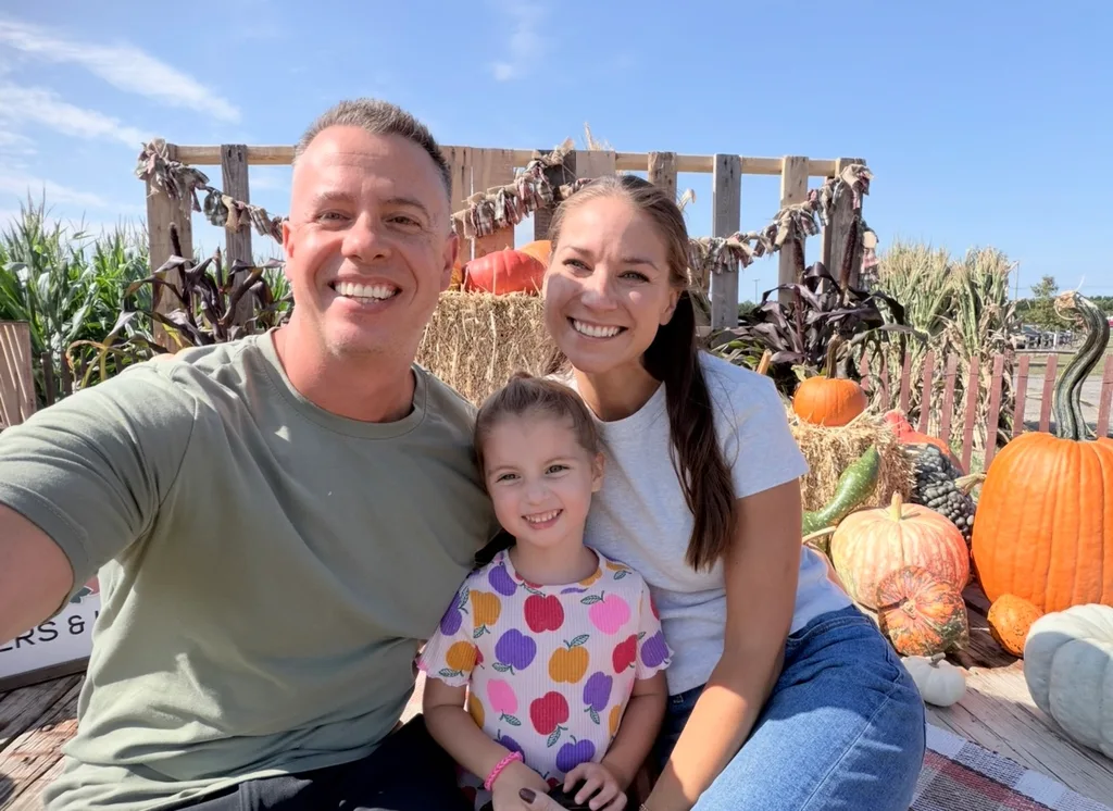 Image of husband, wife and daughter