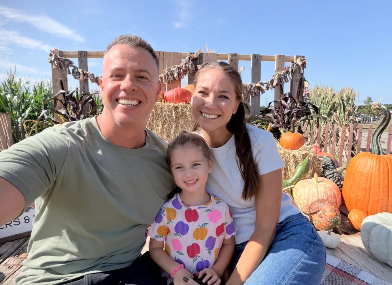 Image of husband, wife and daughter
