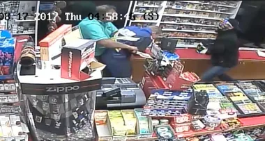 The incredible moment this store clerk fights off armed robbers