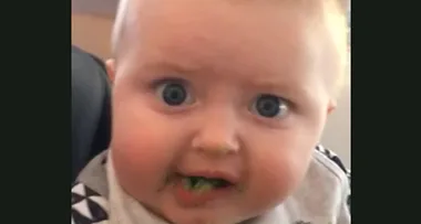 Baby tries broccoli for the first time