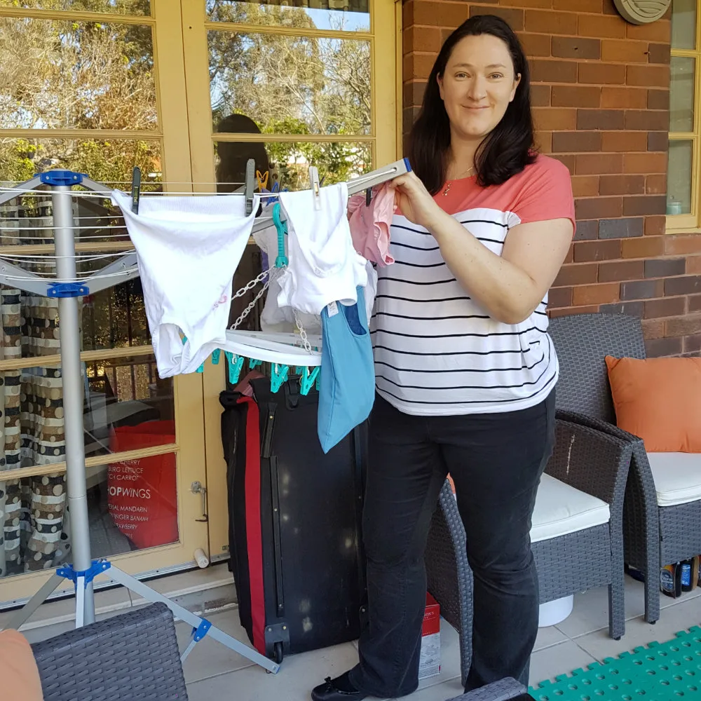 Layla Roberts putting washing out for a client