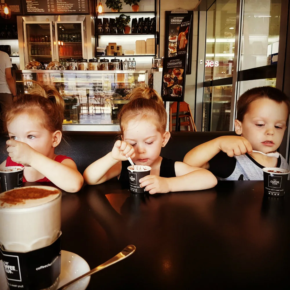 The children enjoying a babyccino