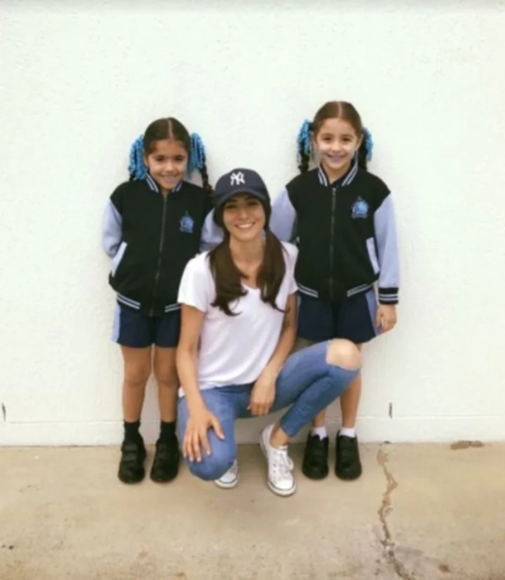 Angela is a single mum to her young twin girls (pictured)