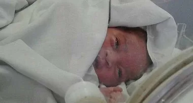 Miracle baby alive after being dumped in storm drain