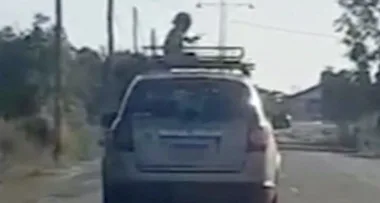 WATCH: Shock video of four-year-old travelling on roof rack of car