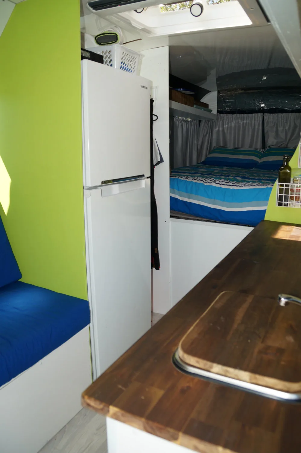 The kitchen and bed inside the bus