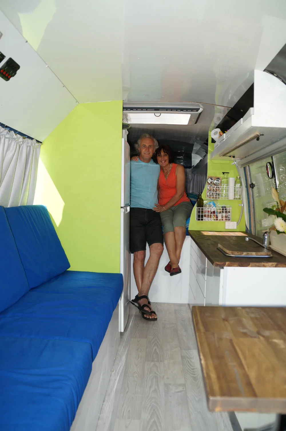 Don and Maria sit inside their bus