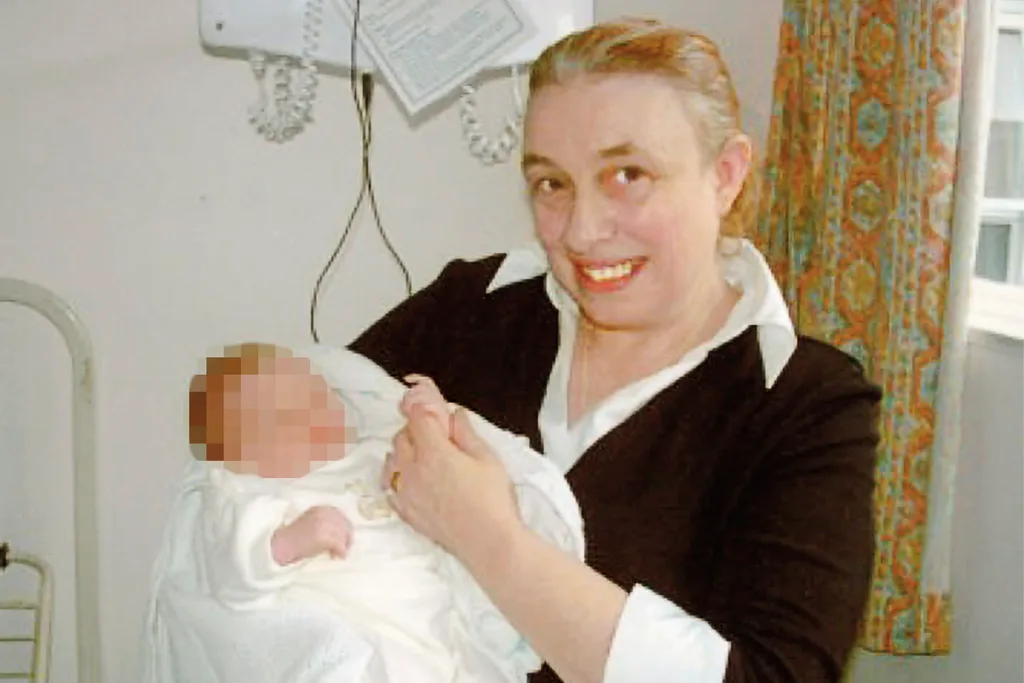 Mum holding her granddaughter
