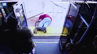Watch: moment woman shoves man off bus to his death