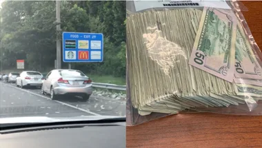 Wads of cash spilled out along the freeway