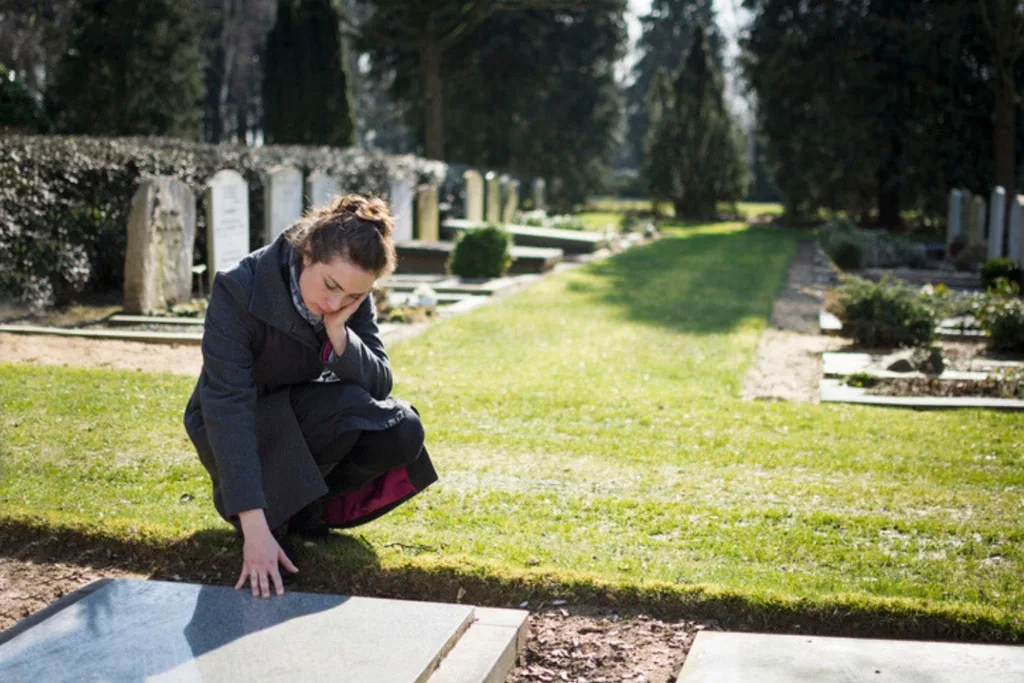Widow by grave