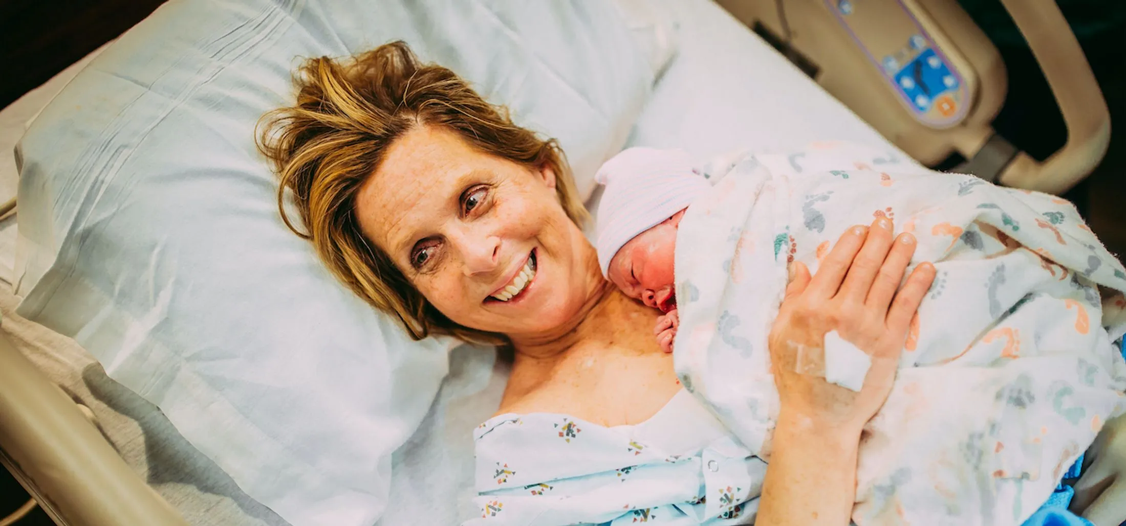 Cecile Eledge holds her granddaughter Uma after giving birth to her