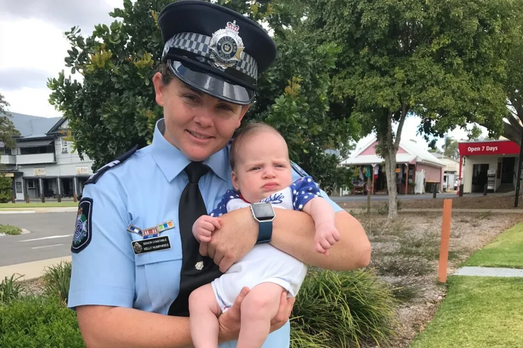 Kelly Humphries in her uniform with her baby nephew