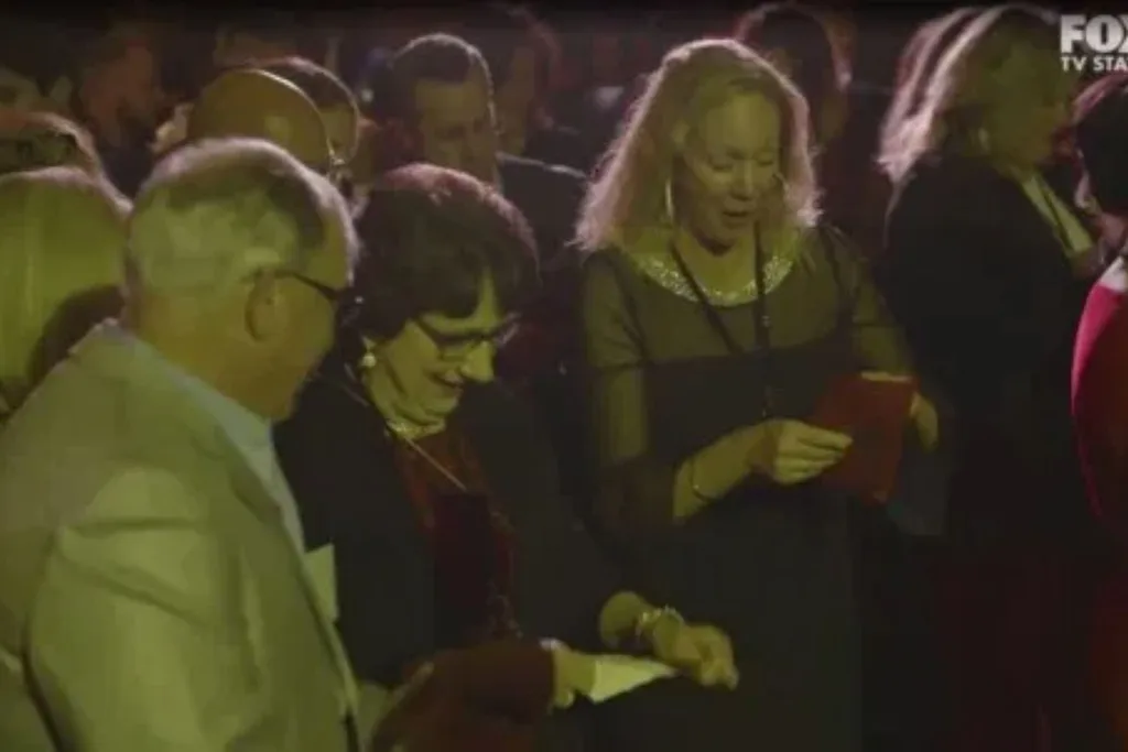 Staff receiving the money
