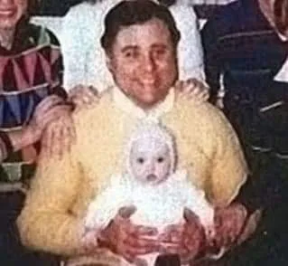 John Robinson holding Heather Robinson