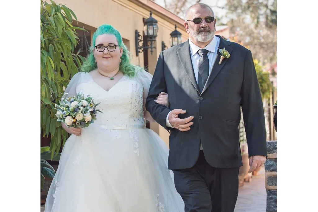 Tony walking Juanita down the aisle