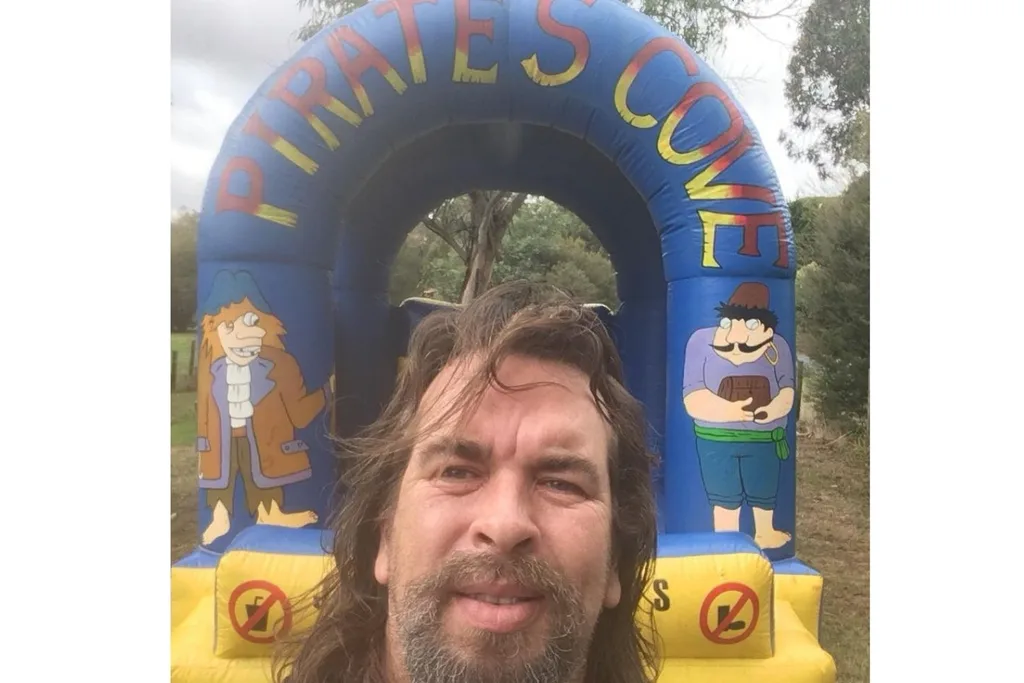 Peter Charleton with bouncy castle