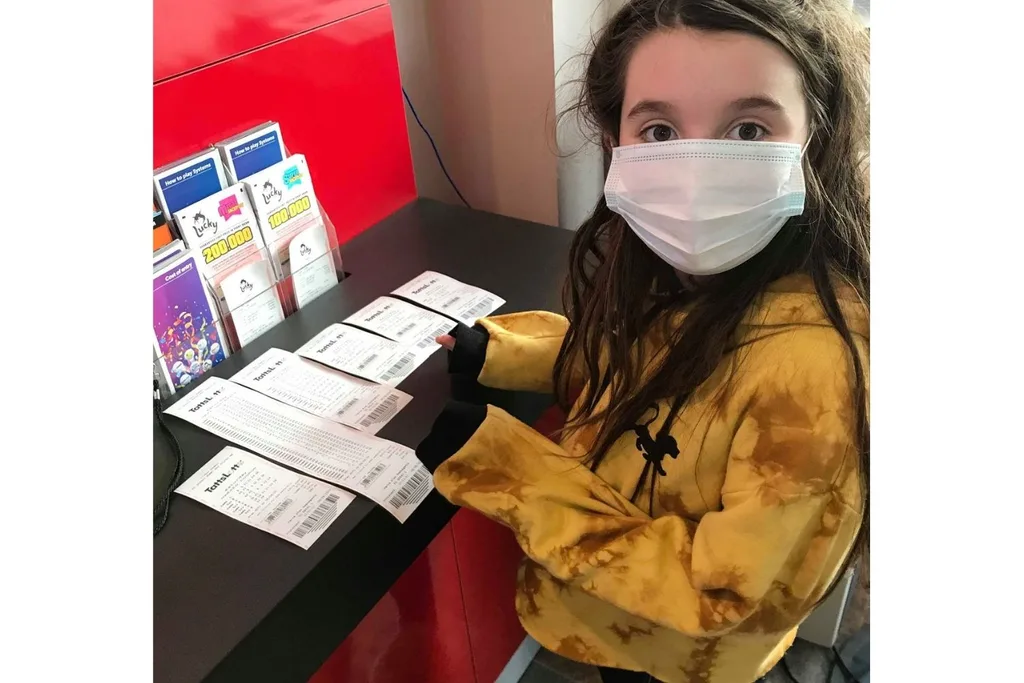 Chelsea Charleton checking Lotto tickets