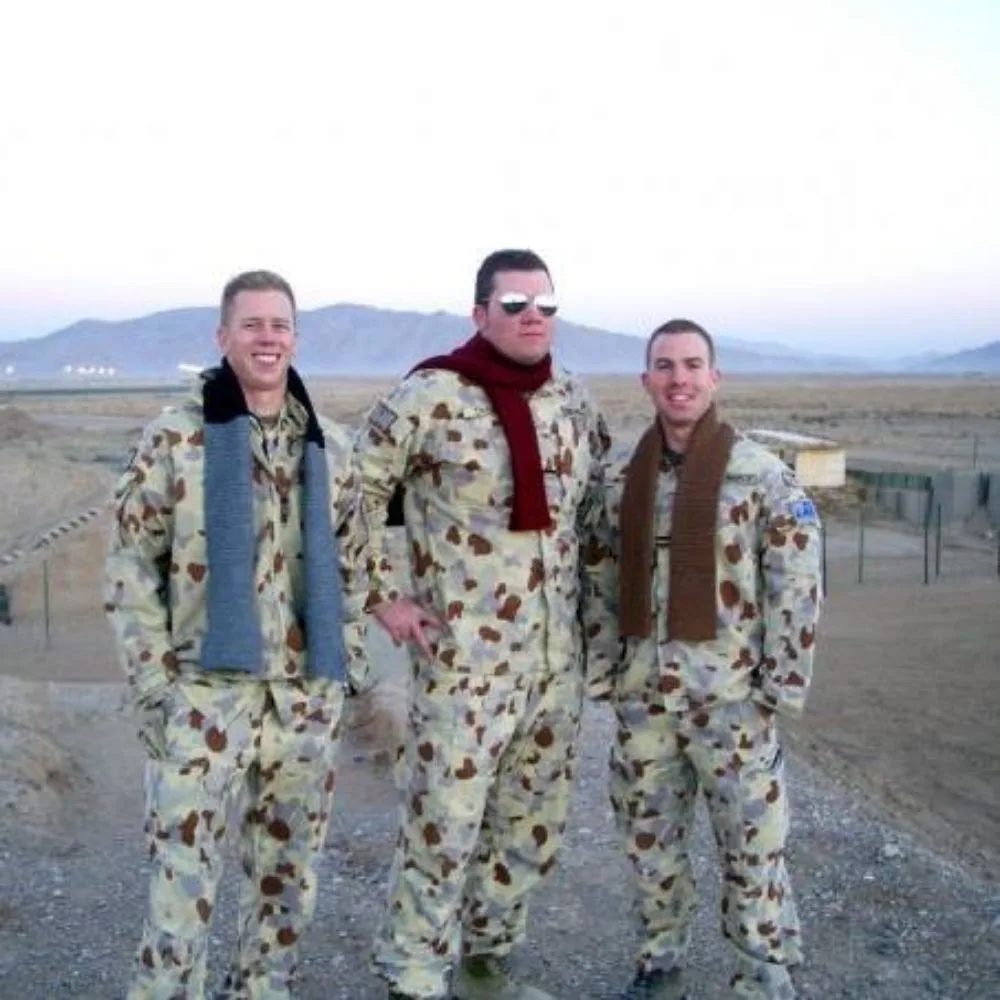 Josh (centre) while he was deployed.