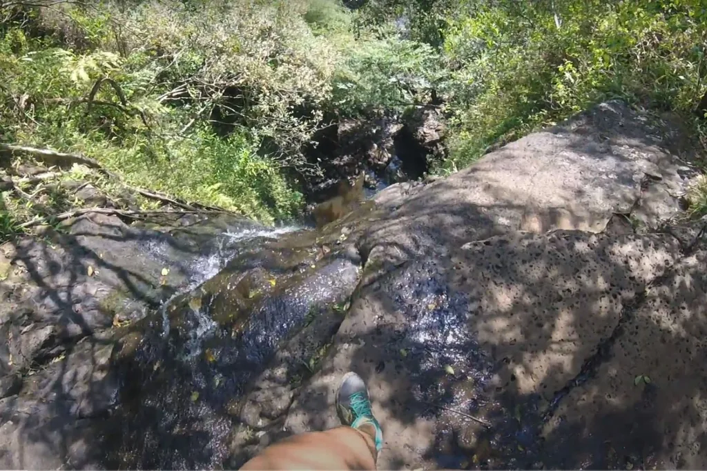 Heather at the top of the waterfall