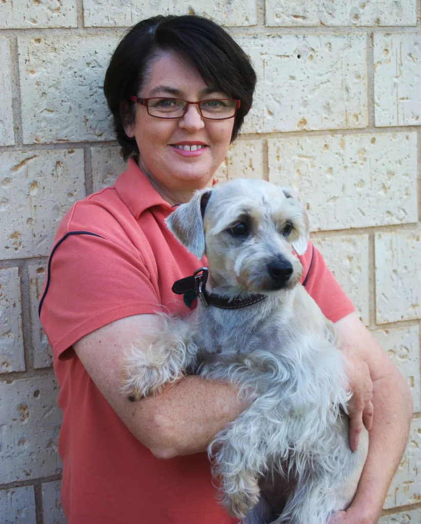 Jenny holding her schnauzer Bertie