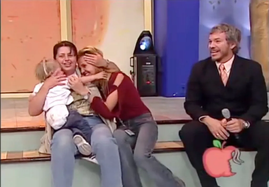 Handler comforts mum and toddler after lion attack ends.