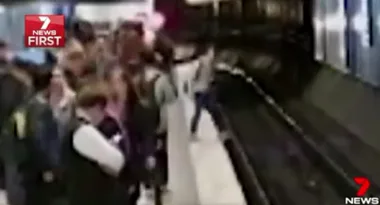 Woman falls onto tracks as train approaches