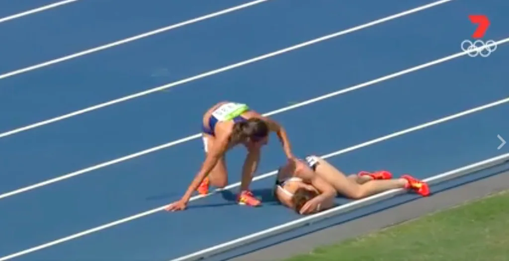 D'Agostino encourages Hamblin to get up.