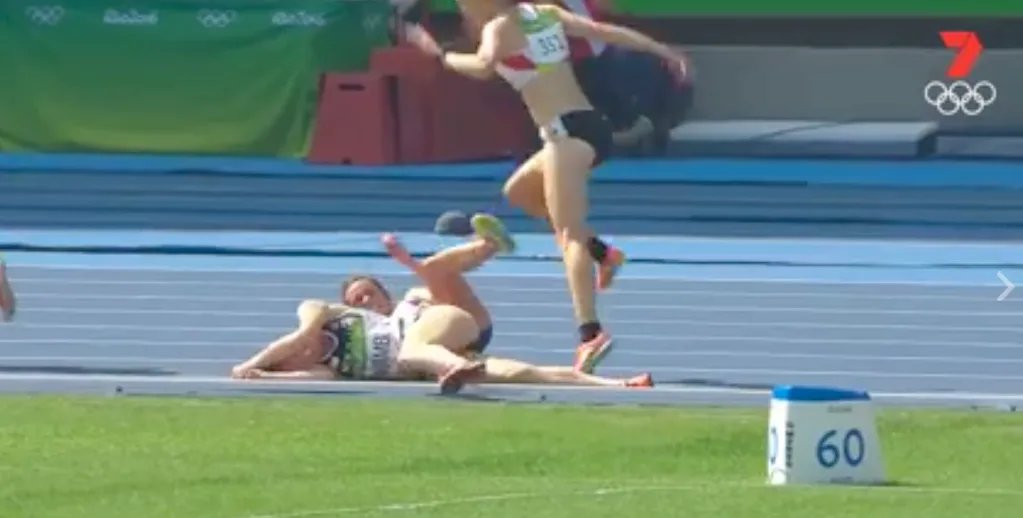 The two runners trip late in the second heat of the women's 5000m.