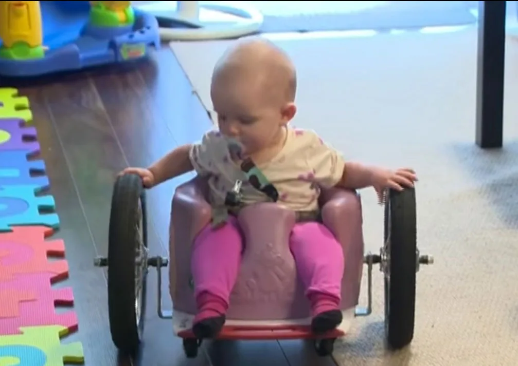 Eva at home in her first wheelchair