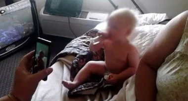 Shock video shows parents giving baby whisky