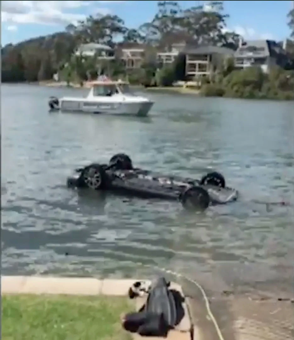 The car rolled into the water when the handbrake wasn't on properly.