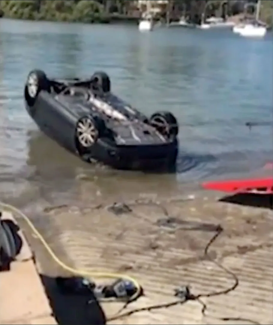 A tow truck came and dragged the car from the water.