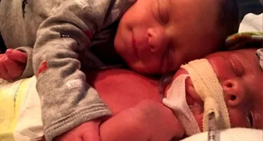 The only thing that comforted this newborn was to be next to his brother