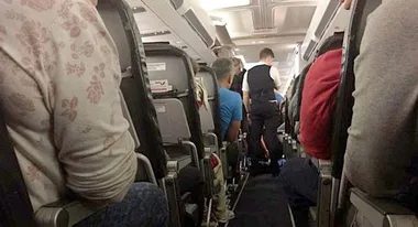 Horrified passengers forced to fly with dead body