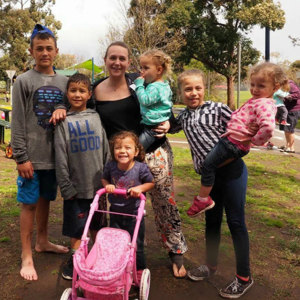 Kimberlee King with her triplets and three other children