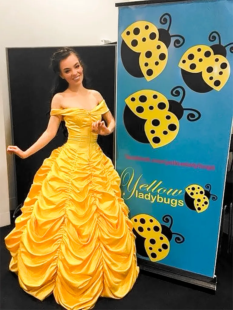Chloe Hayden as Belle from Beauty and the Beast