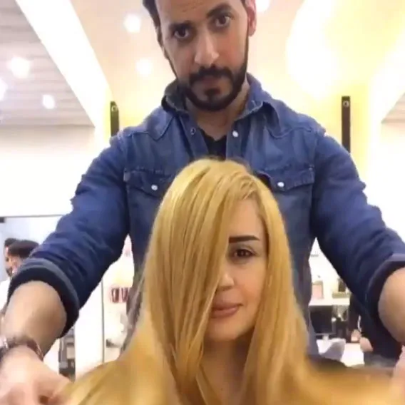 Woman arrives with brassy blonde hair.