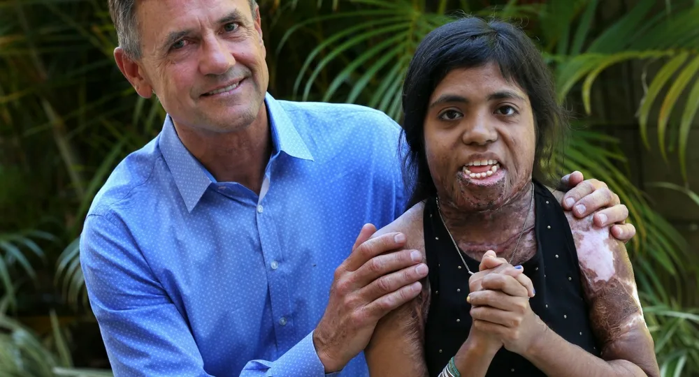 Heldi with plastic surgeon, Dr Tim Cooper