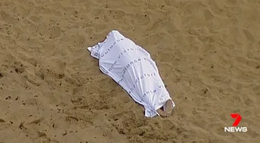 Body of mystery woman found on beach by early morning jogger