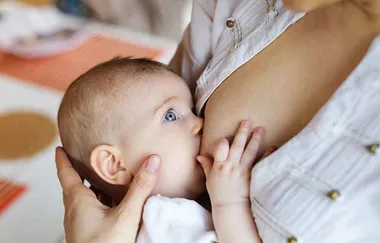 Stunning photos show same-sex couple take turns breastfeeding