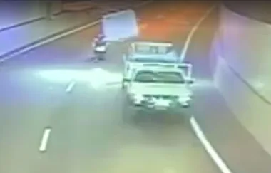 Shocking video as mattress flies off ute and hits motorcyclist in tunnel