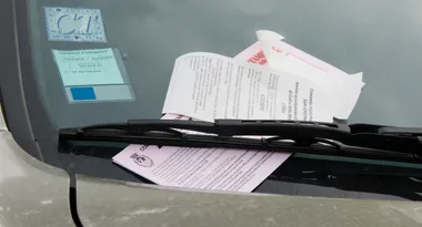 Woman forced to pay $40,000 in fines after parking outside her own home