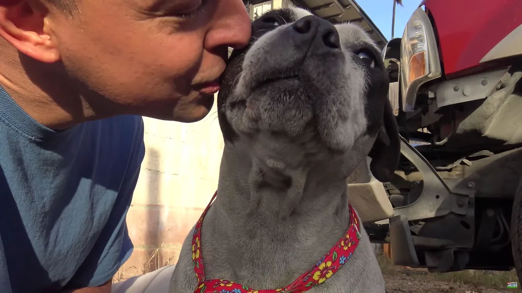 Rescuer gives Leesa a kiss on the cheek.